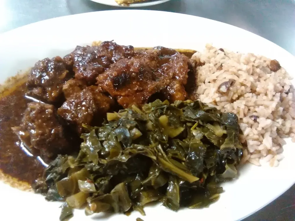 Oxtails Rice and Peas and Greens